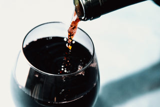 red-wine-pouring-into-a-wine-glass - DISEVIL